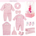 Collection of pink baby clothing and accessories on a white background