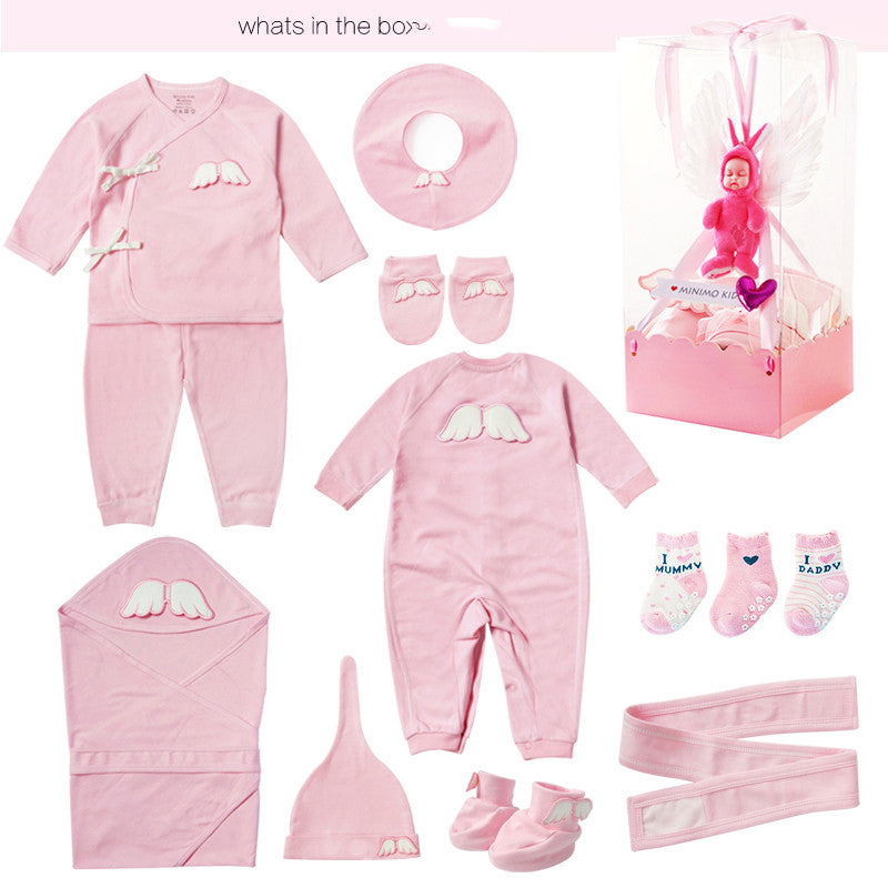 Collection of pink baby clothing and accessories on a white background